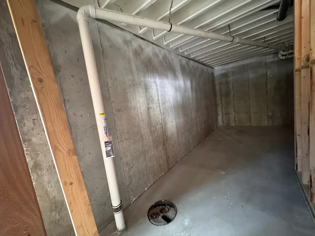 Basement radon system with a U-tube manometer confirming active suction