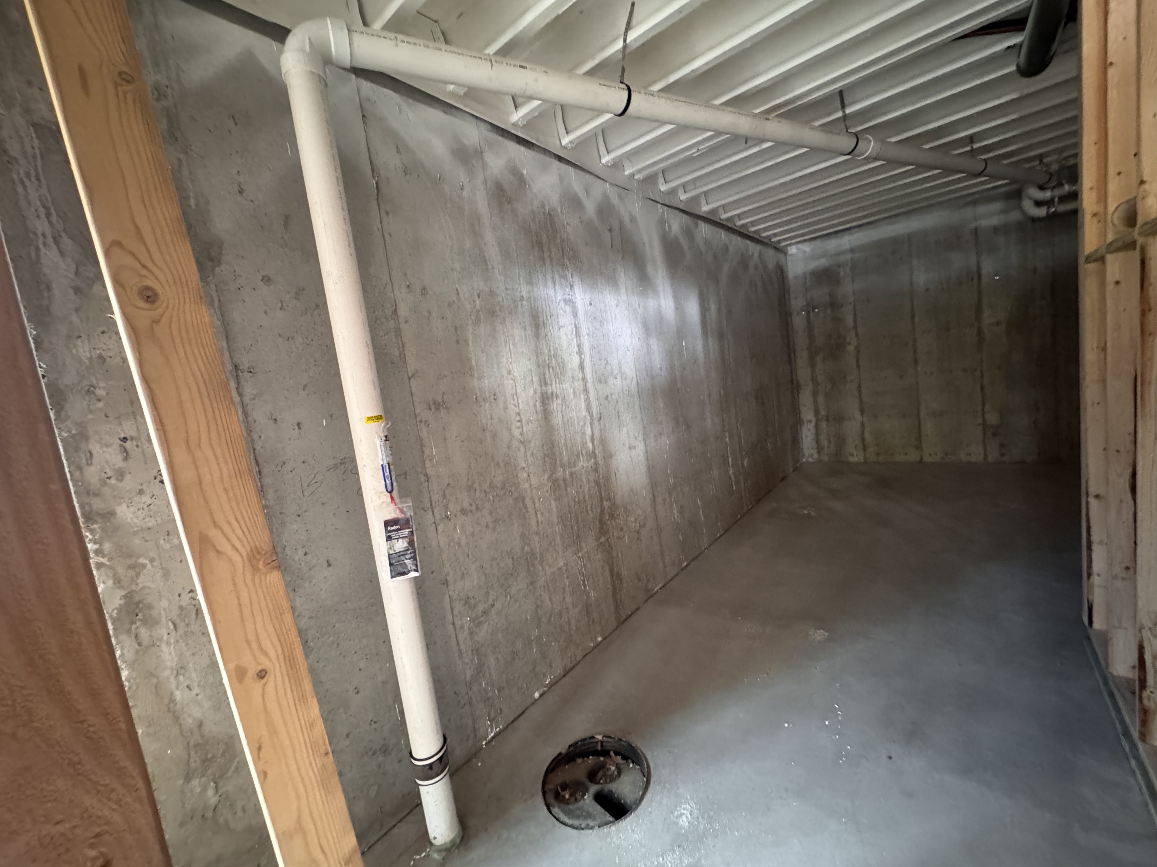 Basement radon system with a U-tube manometer confirming active suction
