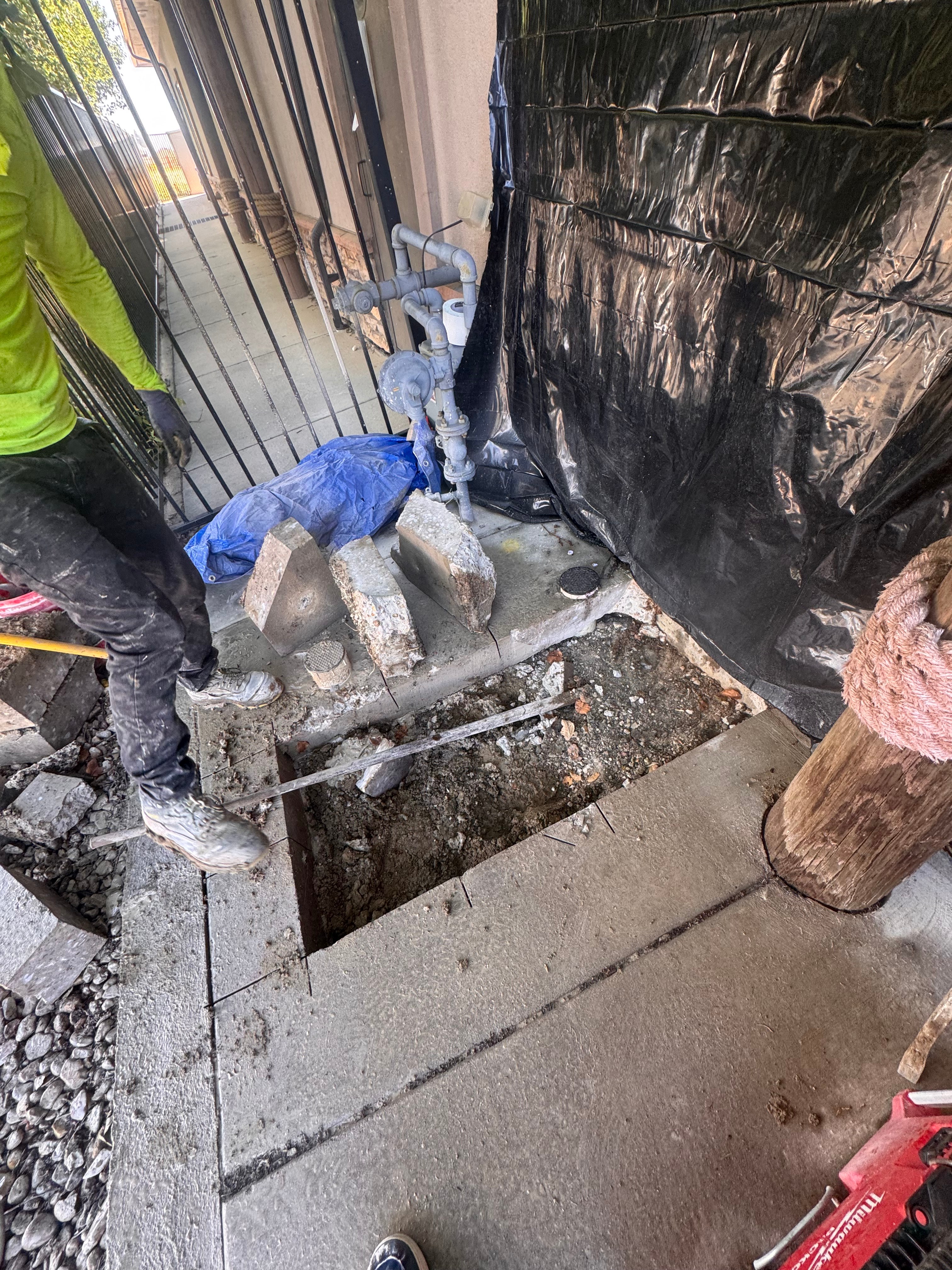 Technician installing a commercial radon system