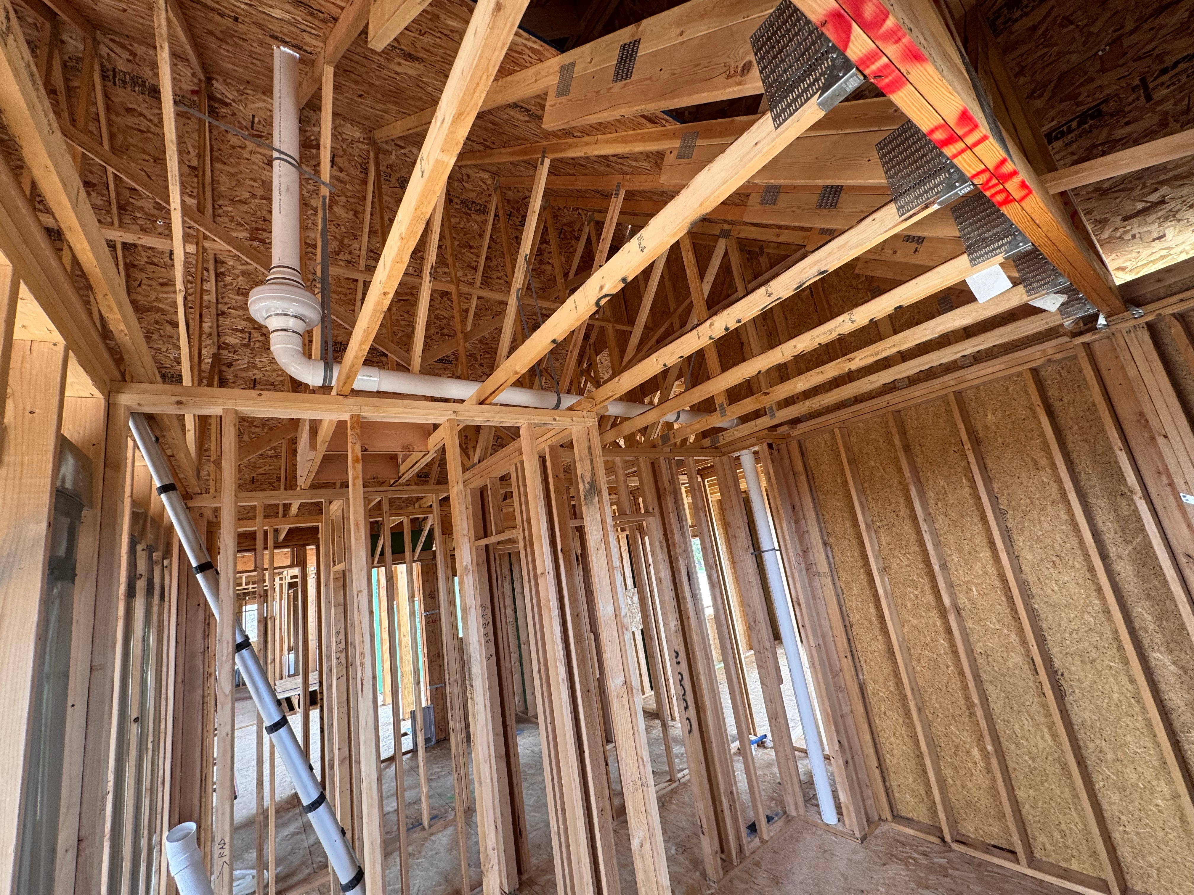 Radon piping routed through a large building ceiling
